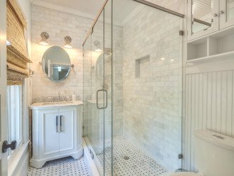 Marble Floors and Shower Walls with Glass Surround and Beadboard