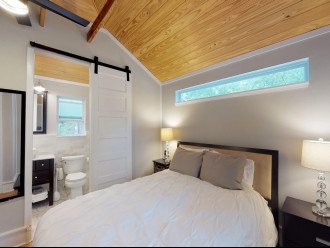 Guesthouse Queen Bedroom with Barn Door leading to the Marble Bath
