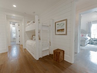 The hallway features a bunk bed as an additional sleeping option.