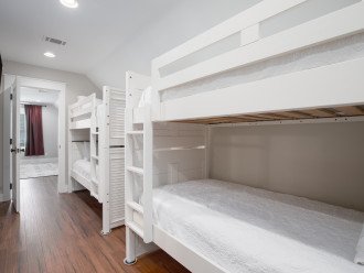Hallway contains 2 bunk beds.