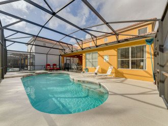 Large pool deck with plenty of space and furniture