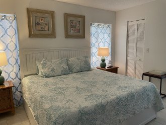 Primary bedroom with king bed, walk-in closet