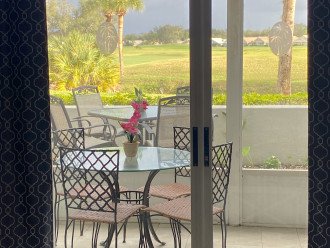 What a view! From living room through lanai over patio to golf course :)