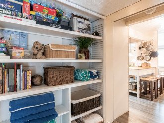 The bookcase in the Lido Room offers guest storage, plus lots of games