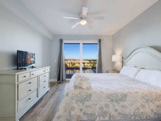 Master Bedroom opens to the large balcony overlooking the lake & the water feature show.