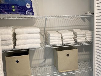 Linen closet with towels and bed linens