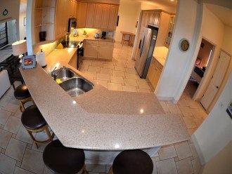 Large open kitchen,stainless steel appl., granite counter tops breakfast bar