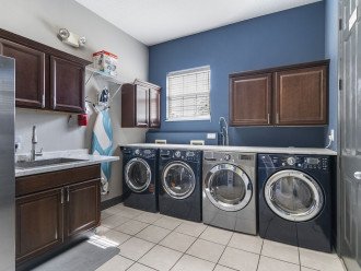 Laundry Rm - 2 LG steam washers/ 2 LG dryers, Ironing board, iron & refrigerator