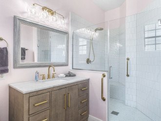 TinkerBell bathroom with bars in shower to help assist.