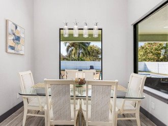 Dining area is right off the kitchen and has gorgeous views of the back patio and pool.