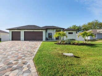 Beautiful paver driveway welcomes you to this home. Quiet outdoor seating area leads you right to the front door.