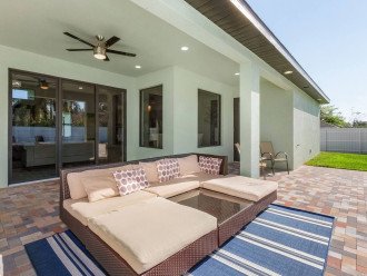 Outdoor weatherproof lounge furniture. Patio doors pictured enter to the living room. Pool is south facing so you can enjoy full sun all day!