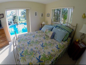 Perfect pool-side guest room with queen bed