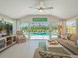 Sunroom overlooking pool and oversized lanai. Open concept