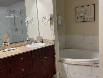 A huge soaking tub with new tile in a Master bathroom