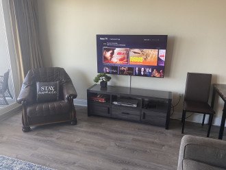 Relax in our living room with a 55" screen TV with plenty of channels and free m