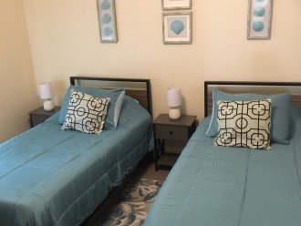 A guest bedroom with two twin-size beds