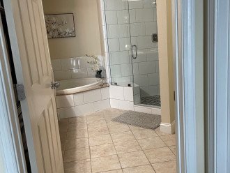 A new tile and glassed-in shower in master bathroom