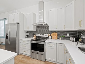 Quartz counters, stainless steel appliances add luxurious feel to roomy kitchen