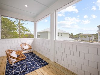 screened in balcony with comfy seating