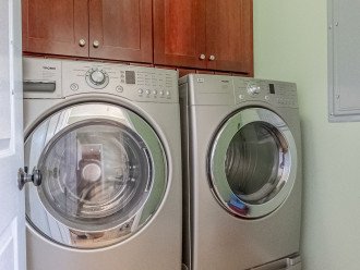 Laundry Room with full size front loader washer n dryer.