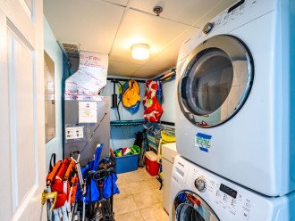 Laundry Room w/ beach supplies, NOT guaranteed BUT feel free to use them - JUST please clean off sand after use BEFORE storing back inside the condo.