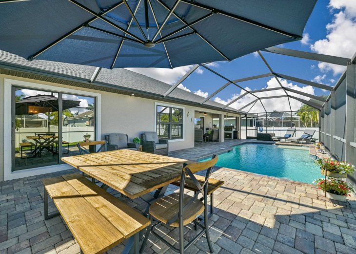 You will be loving the outdoor living at it's best with heated pool, outdoor dining and outdoor kitchen with TV