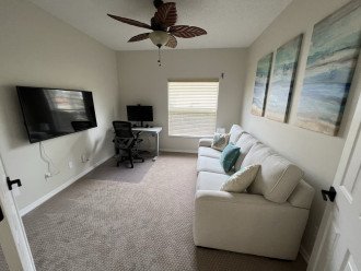 Third bedroom/Den with standing desk and monitor and pull out queen bed
