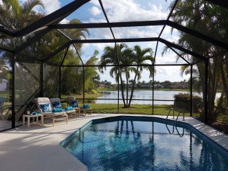 Beautiful view on wide lakefront home with screened solar heated pool #5