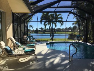 Beautiful view on wide lakefront home with screened solar heated pool #9