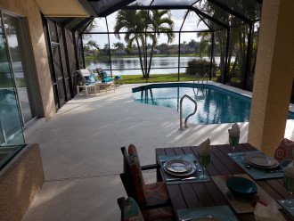 Beautiful view on wide lakefront home with screened solar heated pool #4