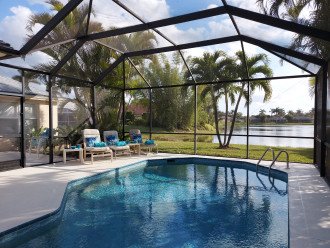 Beautiful view on wide lakefront home with screened solar heated pool #3