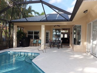 Beautiful view on wide lakefront home with screened solar heated pool #2