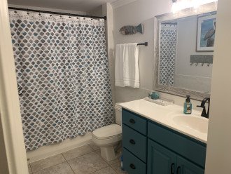 Shared Bath connects to the Double Suite and main foyer.