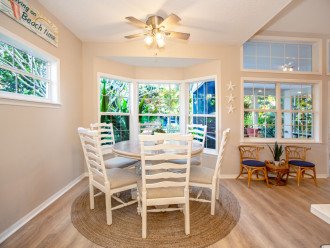 Breakfast nook next to kitchen easily sits 6