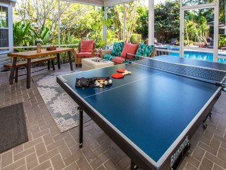 Ping pong table in covered Lanai as well as comfy seating and tables. Watch the kiddos swim from inside the screened lanai!