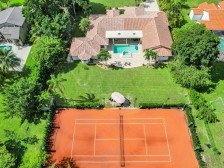 Vacation Tennis House featuring beautiful european red clay tennis court!