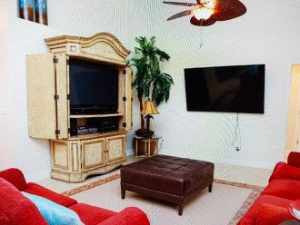 living room with two TVs