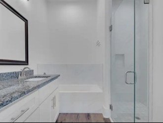 Master bathroom, glass shower and separate tub and toilet.