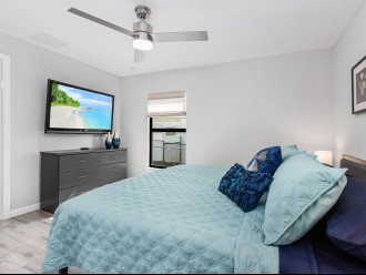 Master bedroom with a king sized bed + 55" inch tv + master bath.