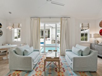 Carriage House Living Space with View of Pool