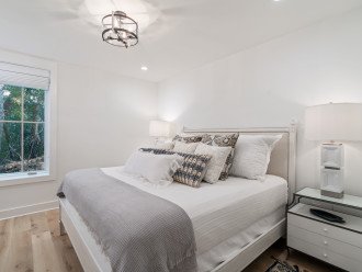 True Master Suite with King Sized Bed along lower level