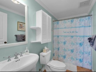 Hallway bedroom, liquid hand soap, hair dryer, tissues, towels