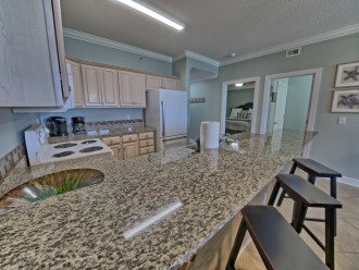 Enjoy family gatherings in the kitchen while sitting at the bar