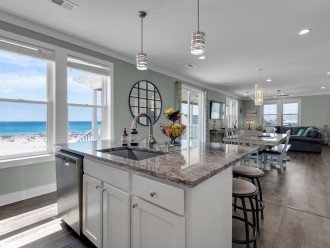 Fully stocked gourmet kitchen with a view, open floor plan, granite