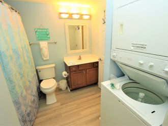 Bathroom with washer and dryer in unit