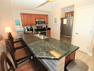 Granite countertops and stainless appliances in the kitchen
