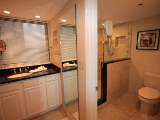 Remodeled master bathroom with separate vanity area.