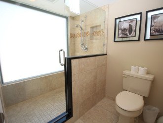 Walk in shower with privacy glass.
