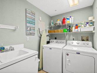 Utility room with sink and new washer and dryer